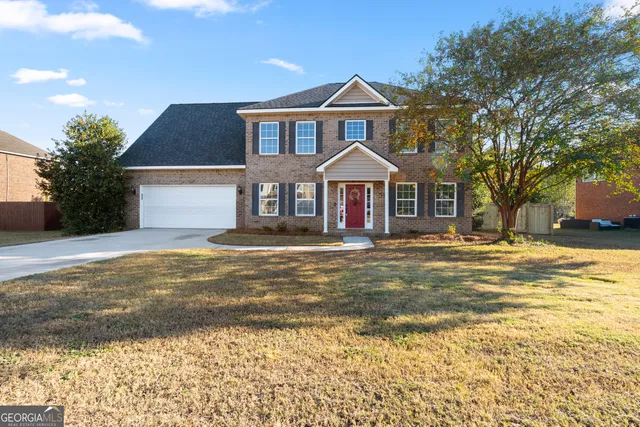 a view of a hallway with wooden floor and windows