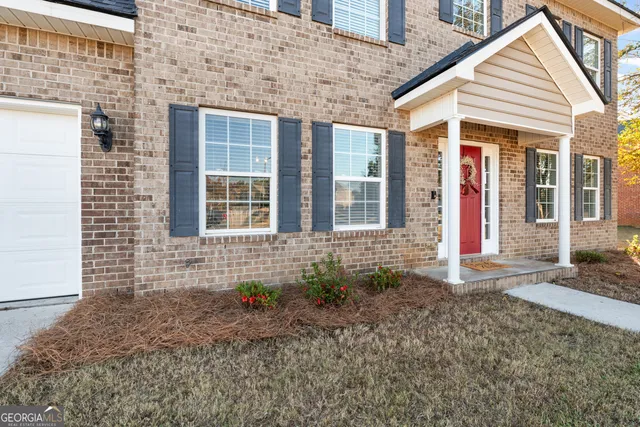 a view of entryway with wooden floor