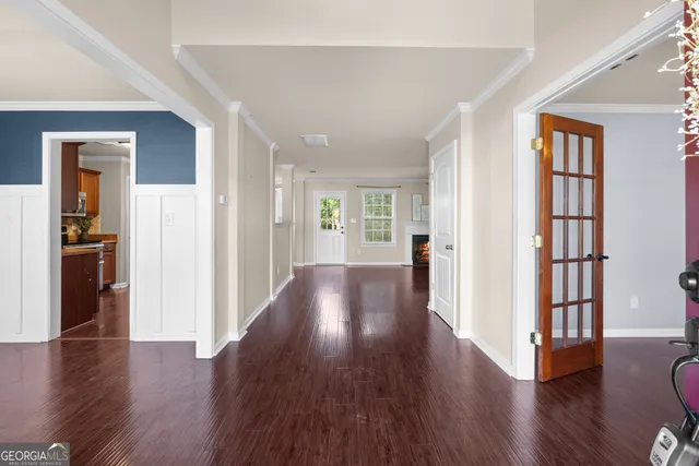 wooden floor in an empty room with a window