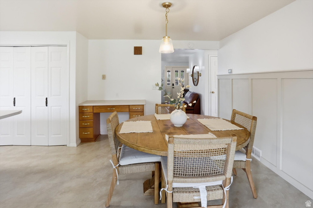 5108 South 2000th Street West Roy, UT 84067 - Photo 13 of 61 Dining area with a decorative wall and concrete flooring