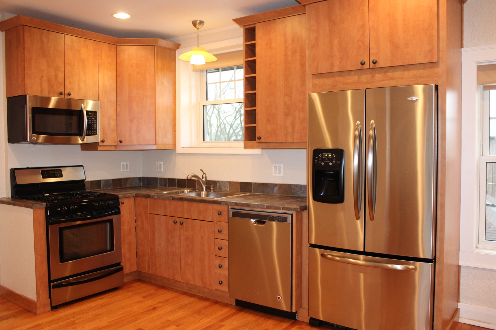 2 South Lincoln Avenue, Unit 3A Park Ridge, IL 60068 - Photo 12 of 26 a kitchen with stainless steel appliances granite countertop a refrigerator and a stove top oven