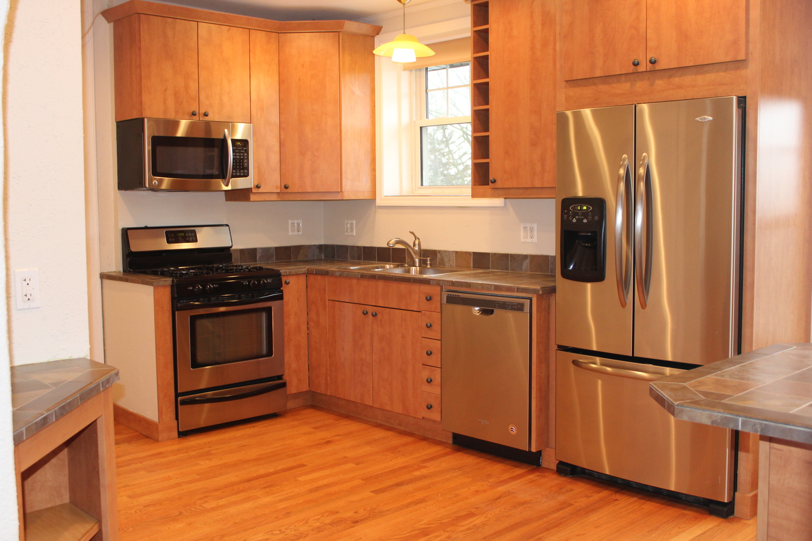 2 South Lincoln Avenue, Unit 3A Park Ridge, IL 60068 - Photo 13 of 26 a kitchen with granite countertop a stove a sink and a refrigerator
