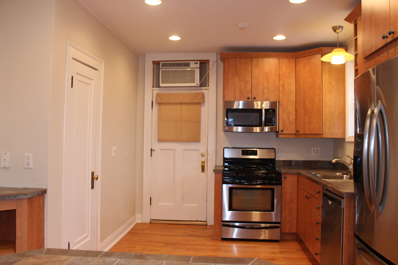 2 South Lincoln Avenue, Unit 3A Park Ridge, IL 60068 - Photo 14 of 26 a kitchen with stainless steel appliances a stove a microwave and a refrigerator