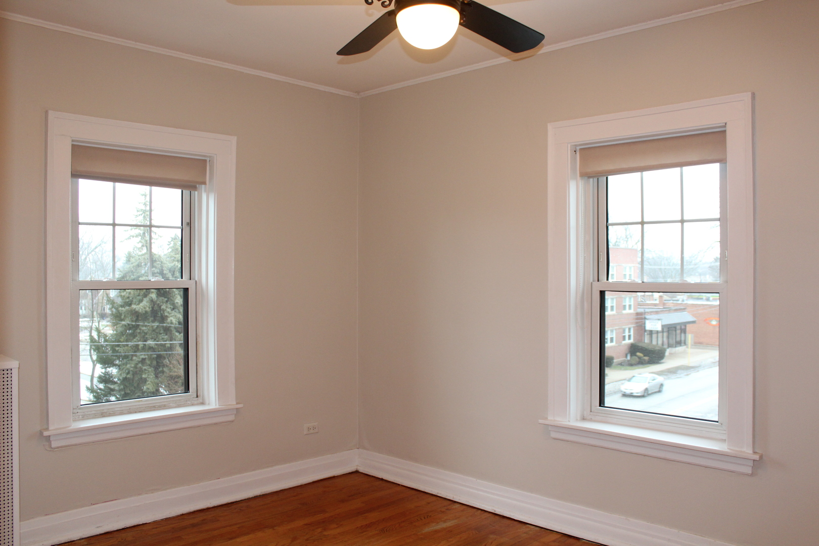 2 South Lincoln Avenue, Unit 3A Park Ridge, IL 60068 - Photo 16 of 26 a view of an empty room with wooden floor and windows