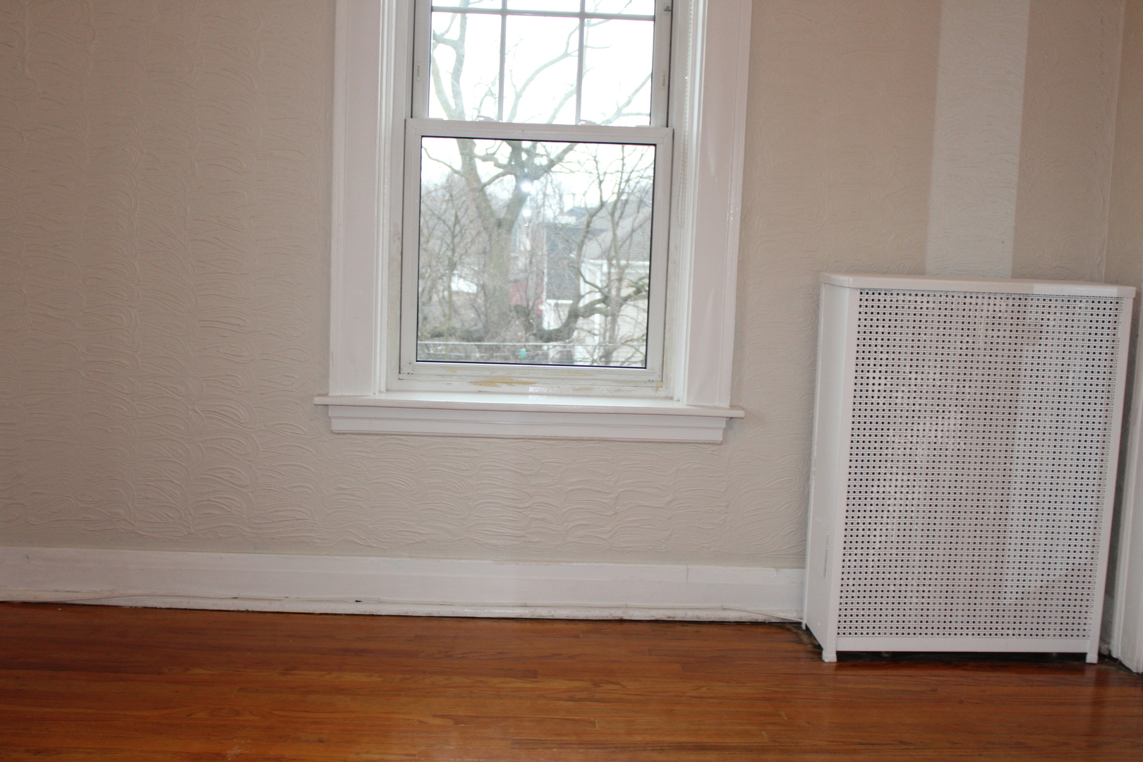 2 South Lincoln Avenue, Unit 3A Park Ridge, IL 60068 - Photo 19 of 26 an empty room with wooden floor and windows