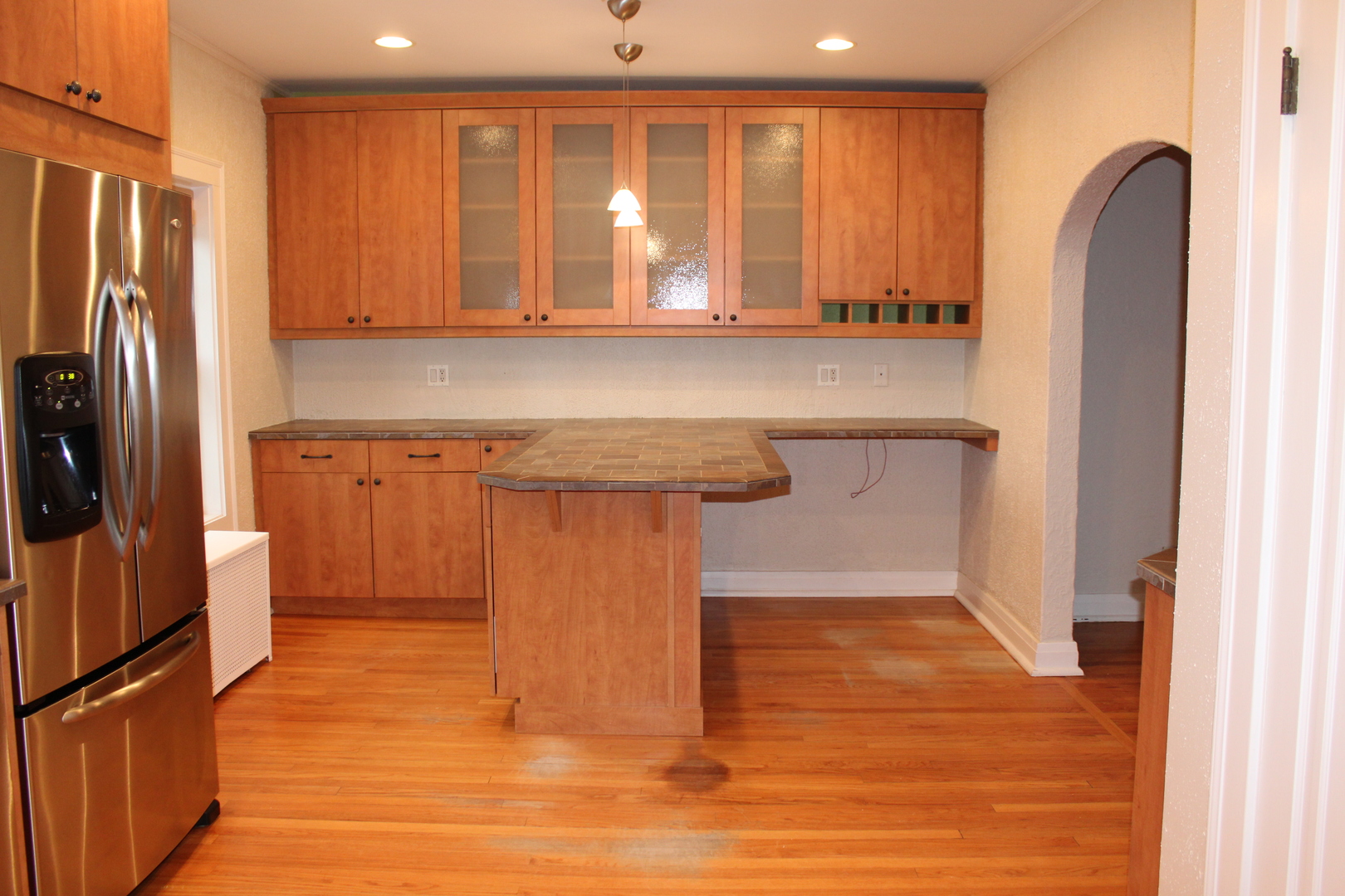 2 South Lincoln Avenue, Unit 3A Park Ridge, IL 60068 - Photo 9 of 26 a kitchen with stainless steel appliances granite countertop a refrigerator a sink and dishwasher with wooden floor