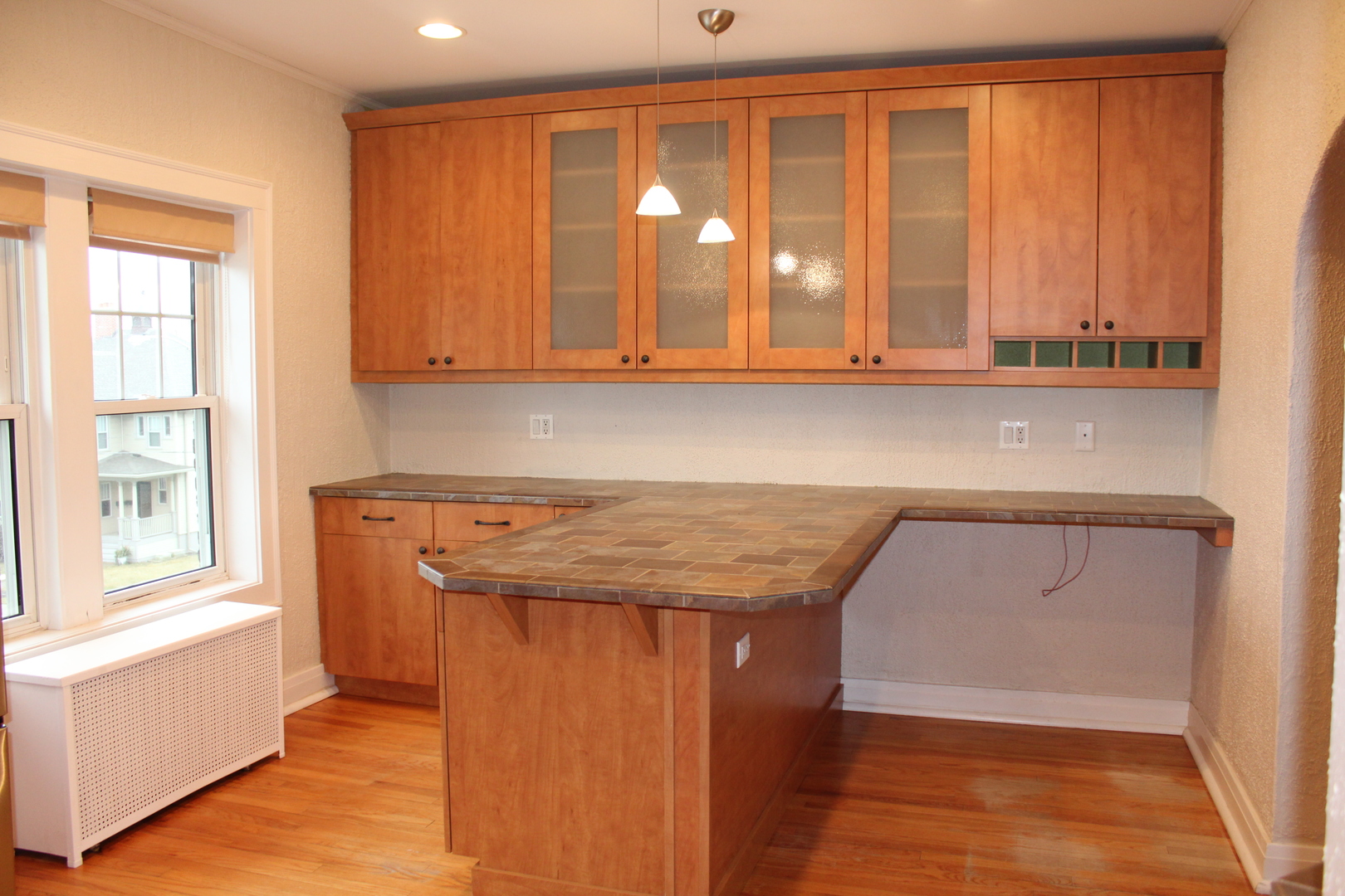 2 South Lincoln Avenue, Unit 3A Park Ridge, IL 60068 - Photo 10 of 26 a kitchen with wooden cabinets and a window