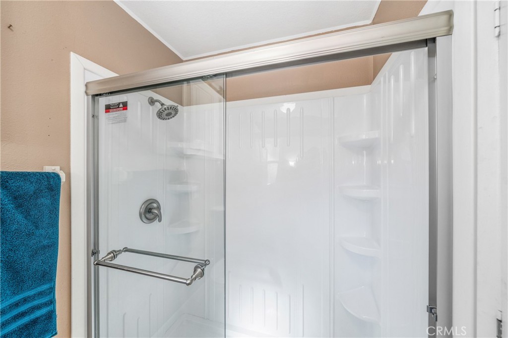 24553 Maitri Road Temescal Valley, CA 92883 - Photo 12 of 36 Guest bath has walk-in shower