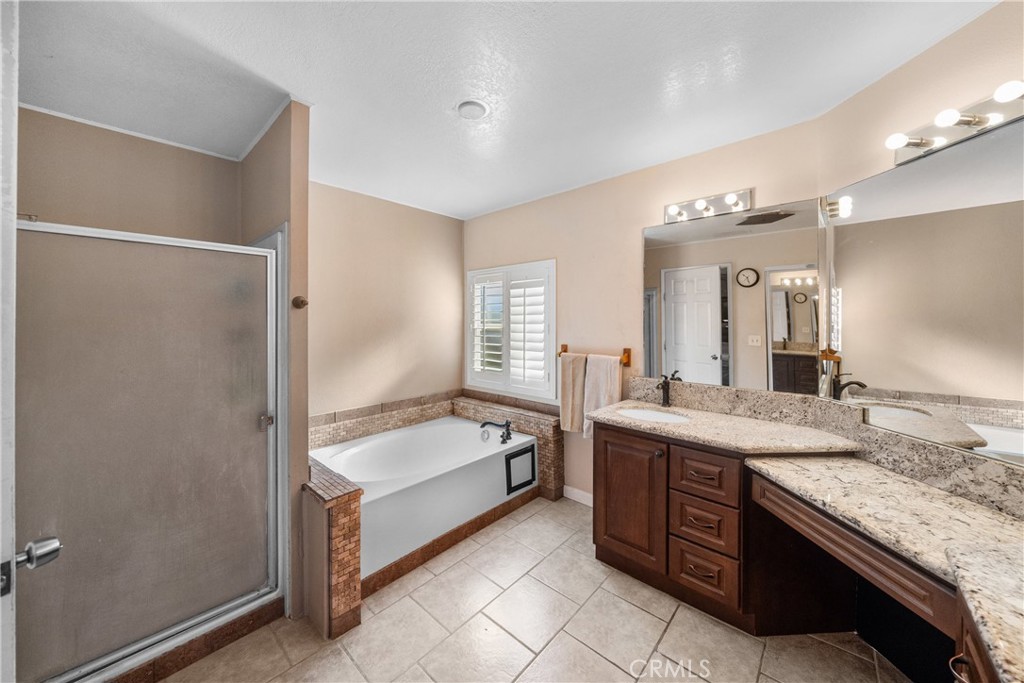 24553 Maitri Road Temescal Valley, CA 92883 - Photo 22 of 36 Soaking tub and separate shower