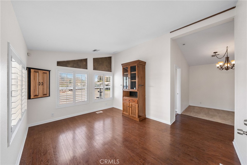 24553 Maitri Road Temescal Valley, CA 92883 - Photo 5 of 36 Living room with wood floors