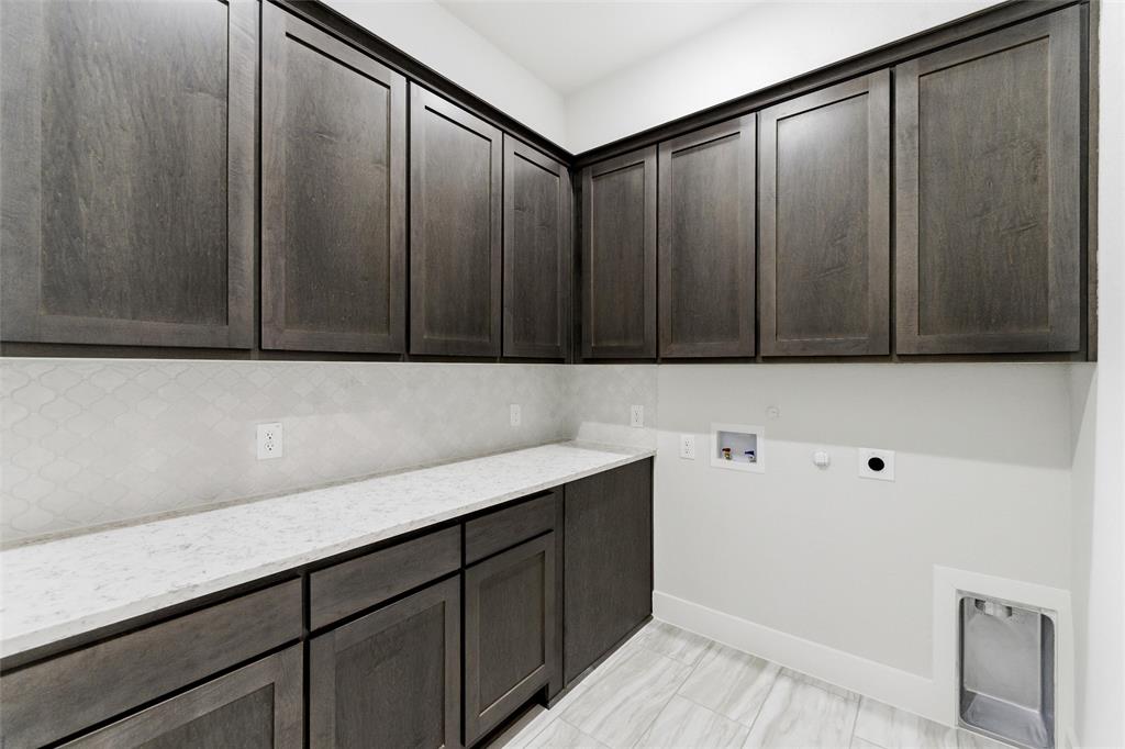805 Vly Rdg Road Van Alstyne, TX 75495 - Photo 24 of 40 a view of cabinets with wooden floor