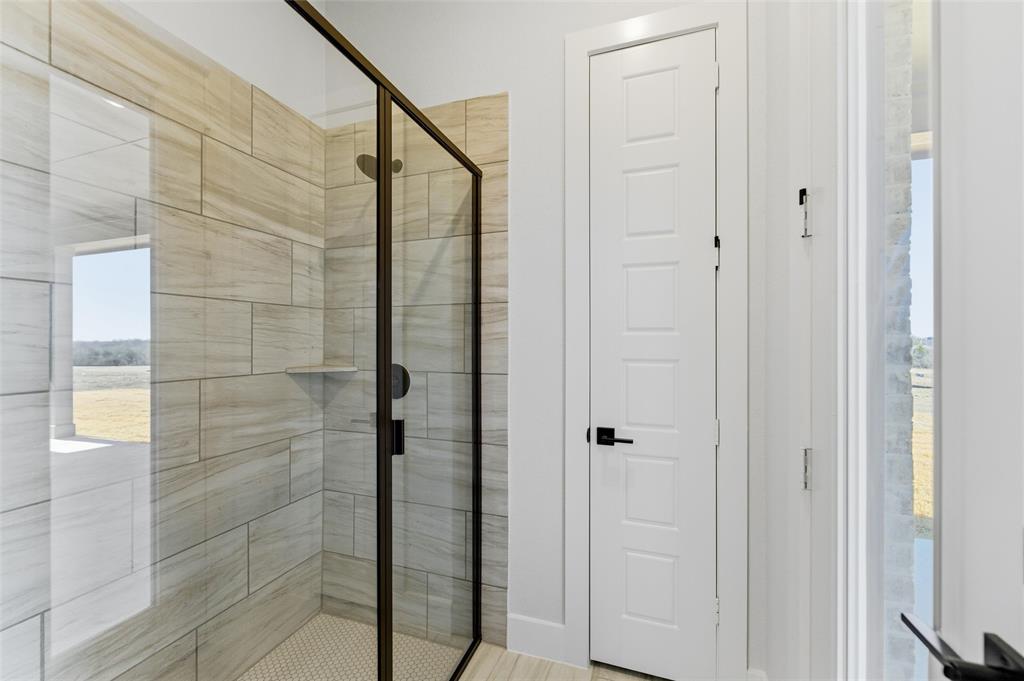 805 Vly Rdg Road Van Alstyne, TX 75495 - Photo 26 of 40 a bathroom with a shower