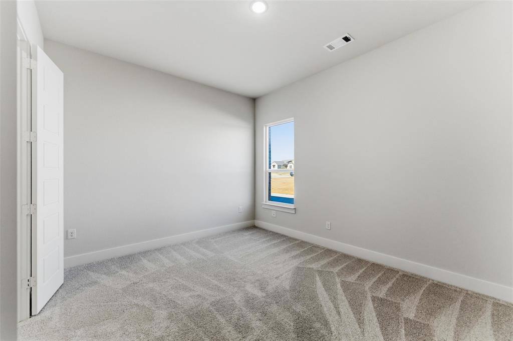 805 Vly Rdg Road Van Alstyne, TX 75495 - Photo 28 of 40 a view of an empty room with a window
