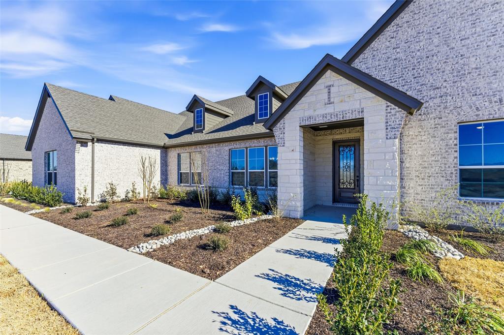 805 Vly Rdg Road Van Alstyne, TX 75495 - Photo 7 of 40 a front view of a house with garden