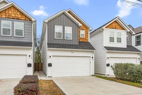 a front view of a house with a garage