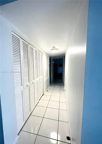 a view of an entryway with a hallway