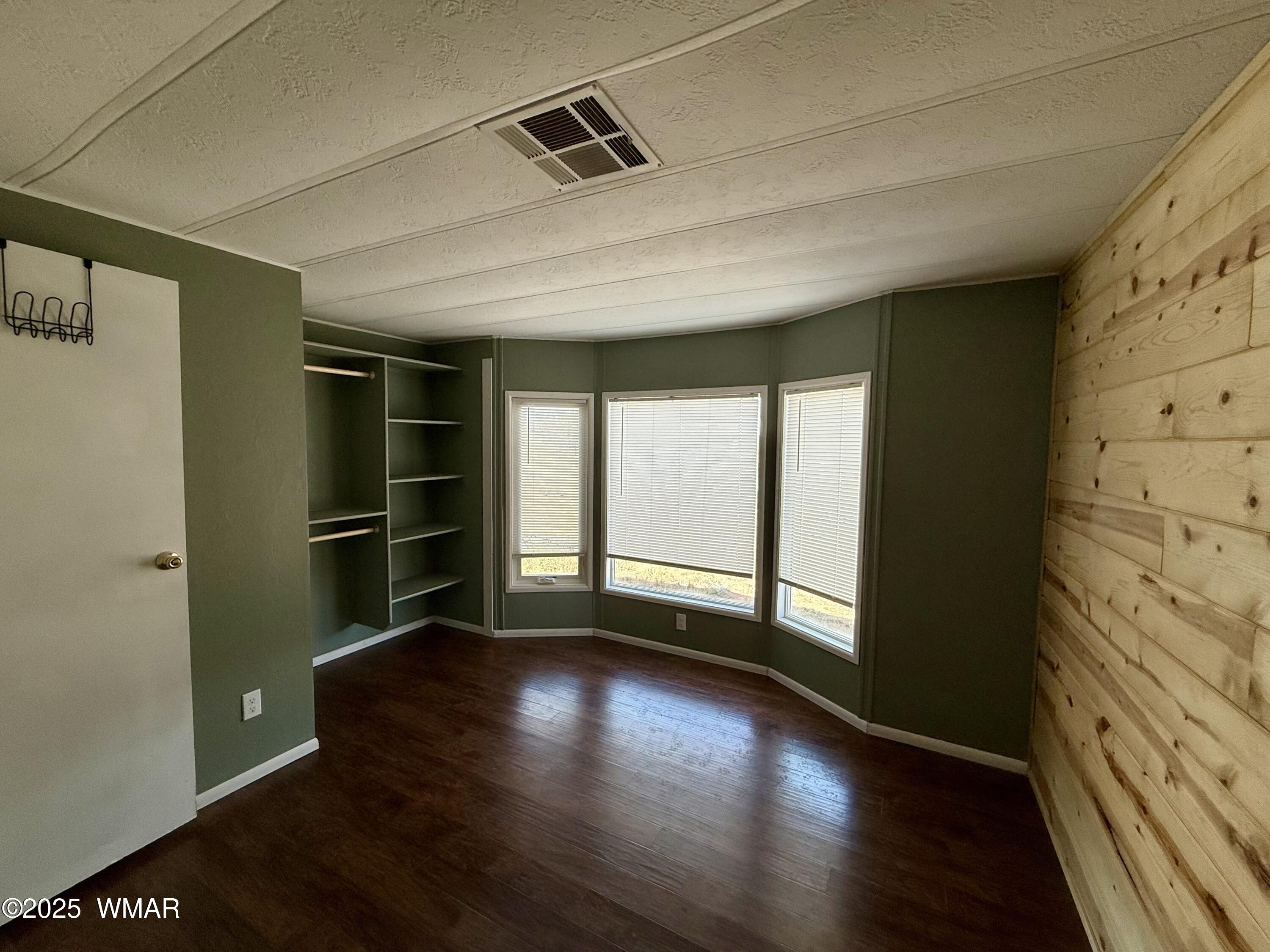 3908 South Freeman Holw Road Snowflake, AZ 85937 - Photo 20 of 31 a view of wooden floor and windows in a room