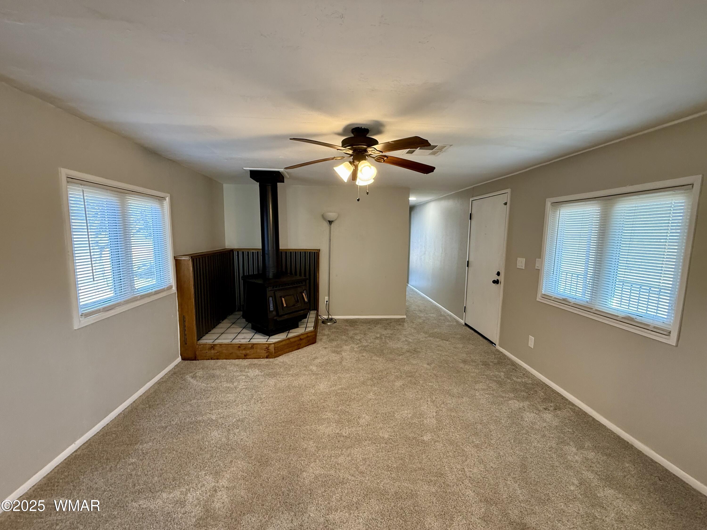 3908 South Freeman Holw Road Snowflake, AZ 85937 - Photo 4 of 31 a living room with furniture and a ceiling fan