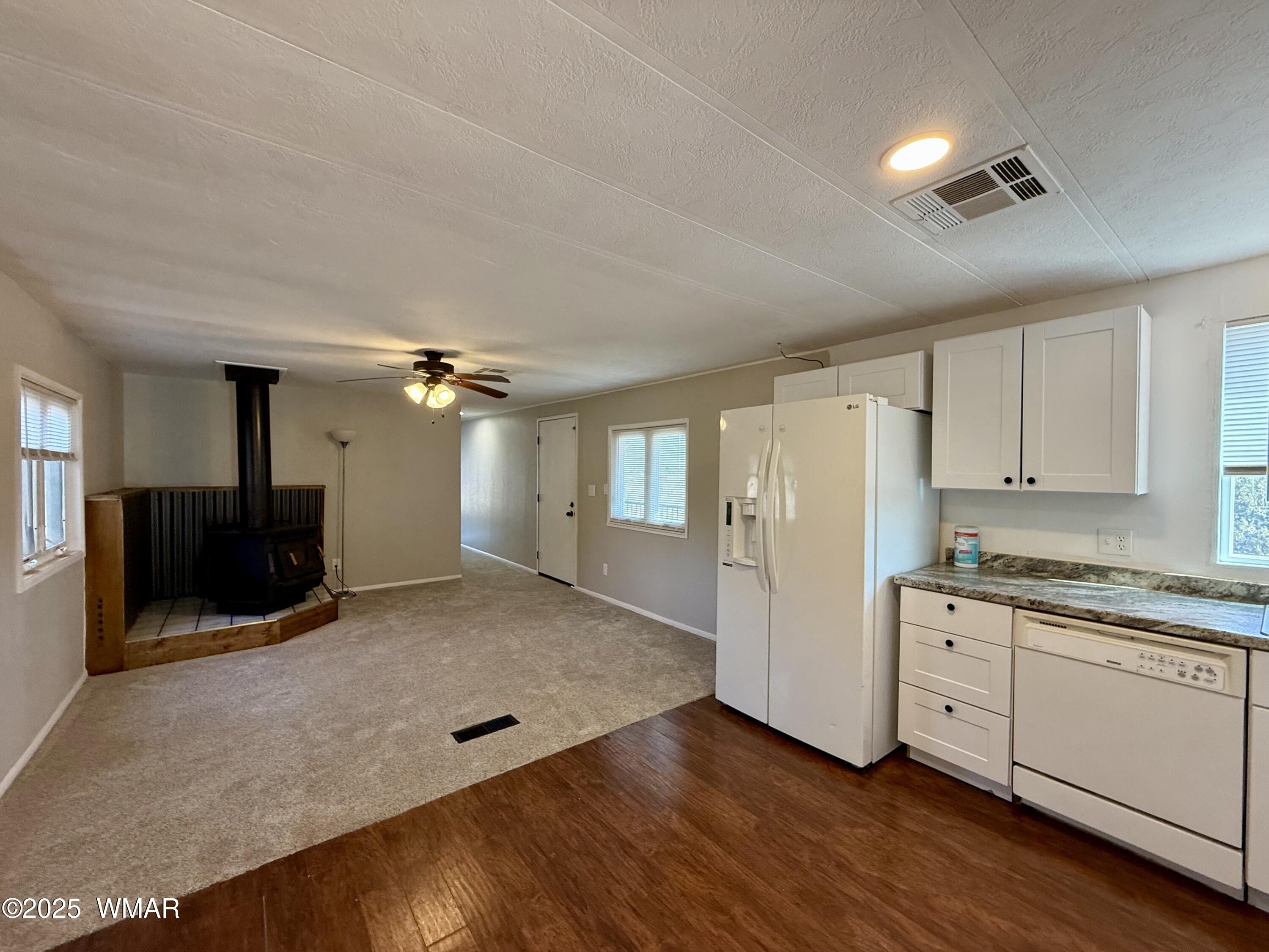 3908 South Freeman Holw Road Snowflake, AZ 85937 - Photo 5 of 31 a kitchen with stainless steel appliances granite countertop a stove a sink and a refrigerator