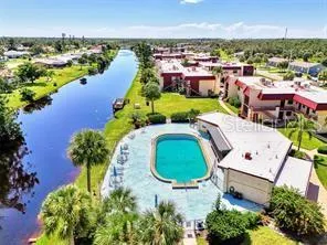 an aerial view of a house with yard swimming pool and outdoor seating