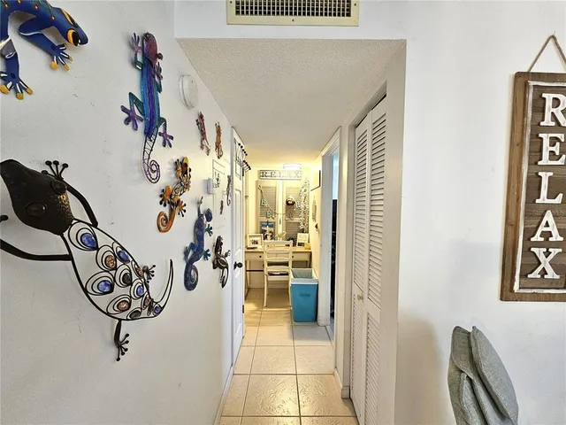 a view of a livingroom with a window and couch