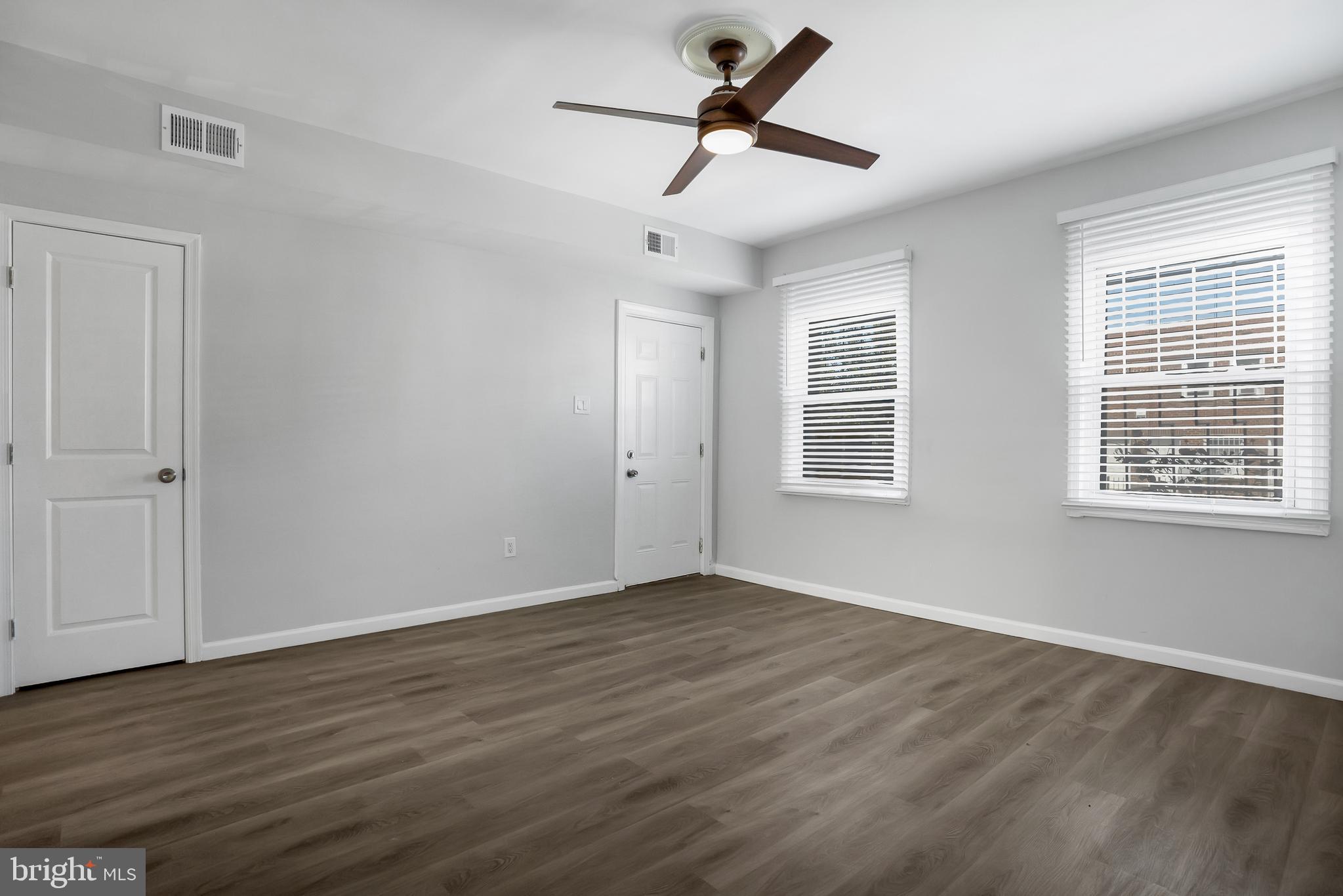 1223 Simms Place Northeast, Unit 1 Washington, DC 20002 - Photo 11 of 48 a view of empty room with wooden floor and fan