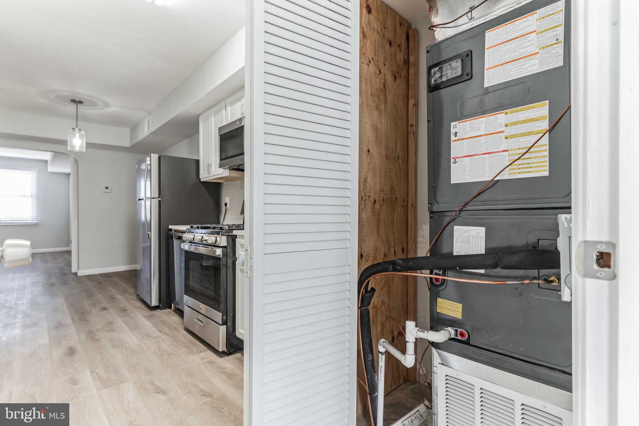 1223 Simms Place Northeast, Unit 1 Washington, DC 20002 - Photo 13 of 48 a view of a kitchen with refrigerator and windows