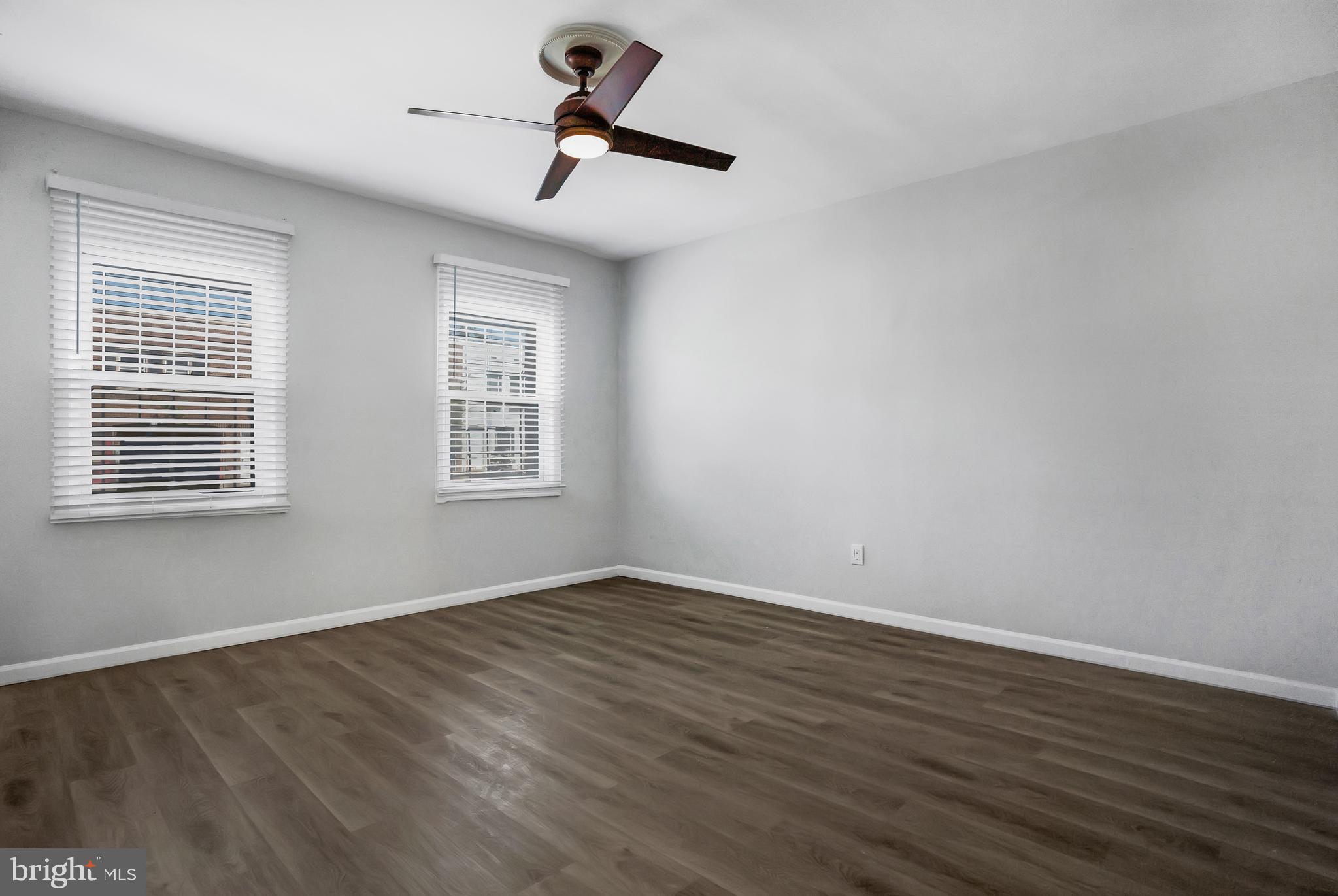 1223 Simms Place Northeast, Unit 1 Washington, DC 20002 - Photo 15 of 48 a view of empty room with wooden floor and fan