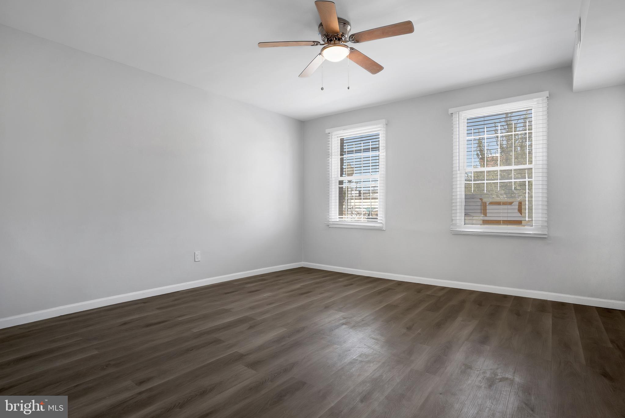 1223 Simms Place Northeast, Unit 1 Washington, DC 20002 - Photo 19 of 48 a view of empty room with wooden floor and fan