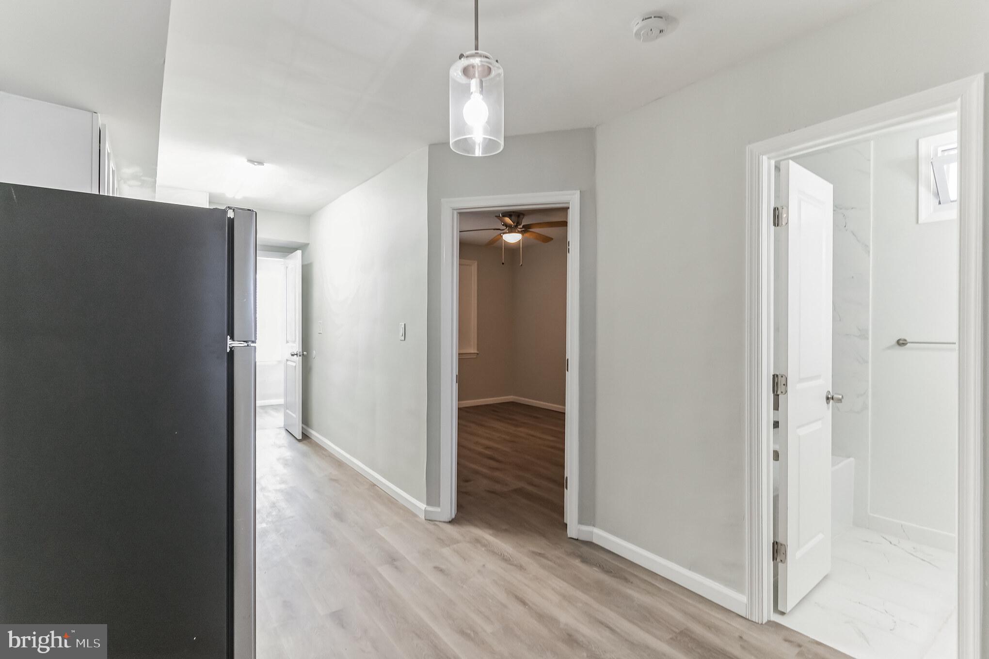 1223 Simms Place Northeast, Unit 1 Washington, DC 20002 - Photo 22 of 48 a view of a hallway with wooden floor and closet area