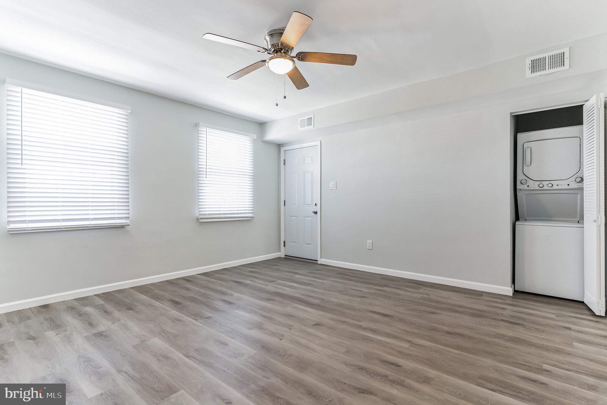 1223 Simms Place Northeast, Unit 1 Washington, DC 20002 - Photo 24 of 48 wooden floor in an empty room with a window