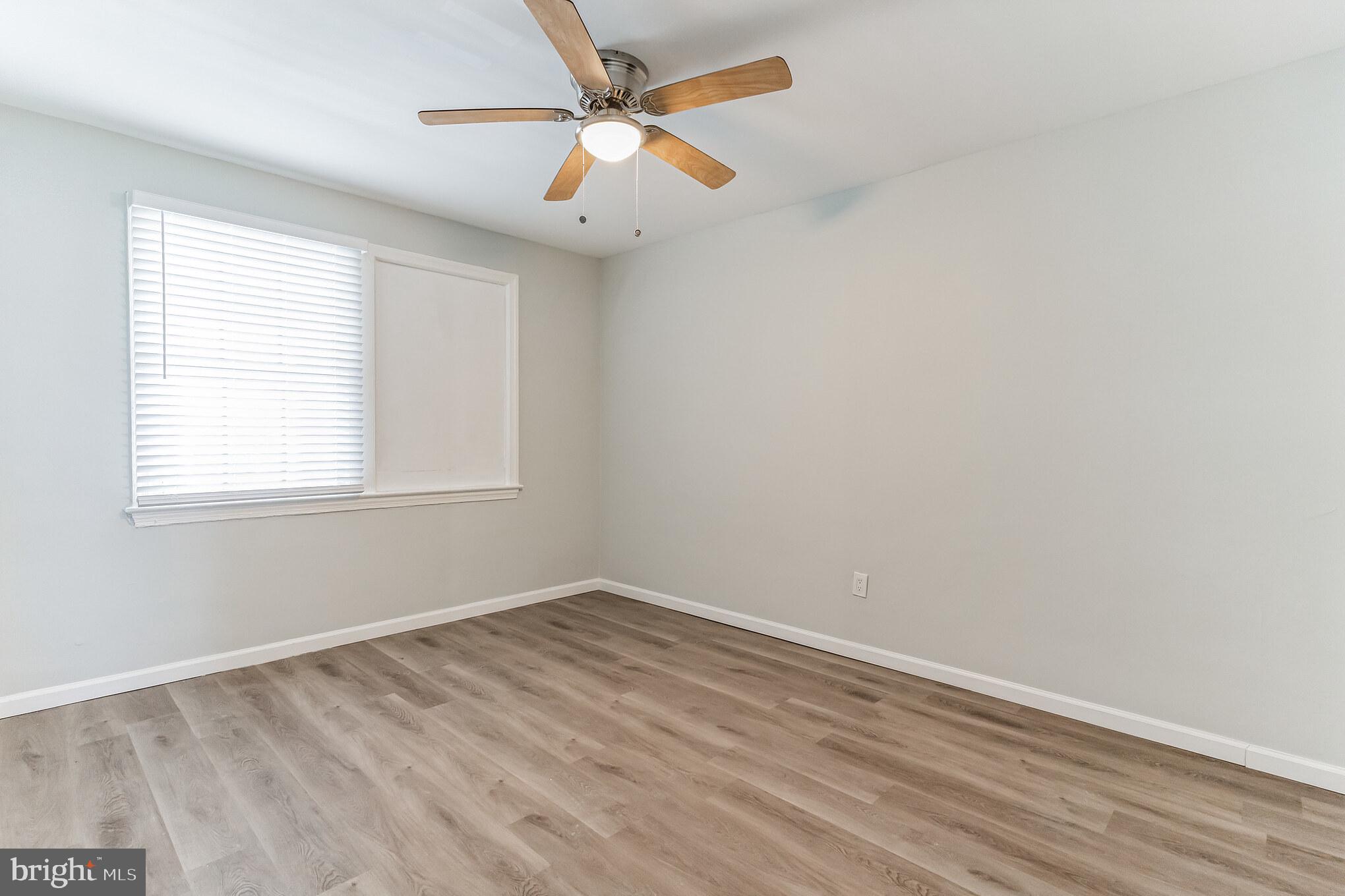 1223 Simms Place Northeast, Unit 1 Washington, DC 20002 - Photo 25 of 48 an empty room with a window and a fan