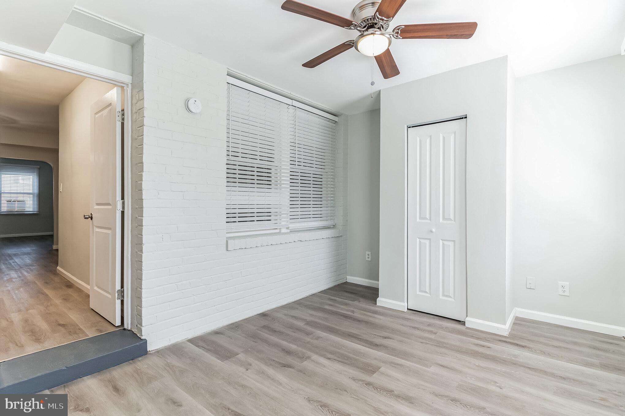 1223 Simms Place Northeast, Unit 1 Washington, DC 20002 - Photo 30 of 48 a view of an empty room with wooden floor and a window