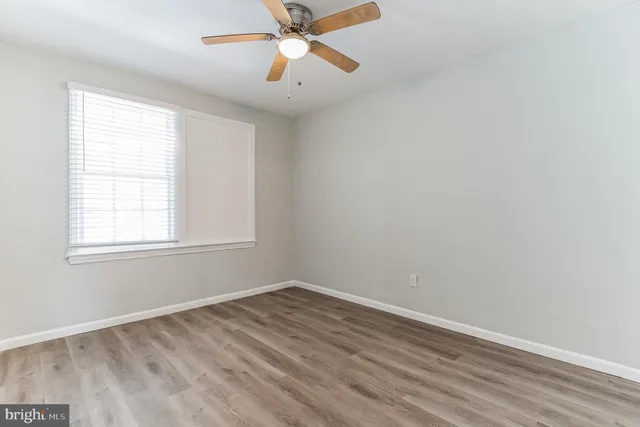 a bathroom with a sink mirror and toilet