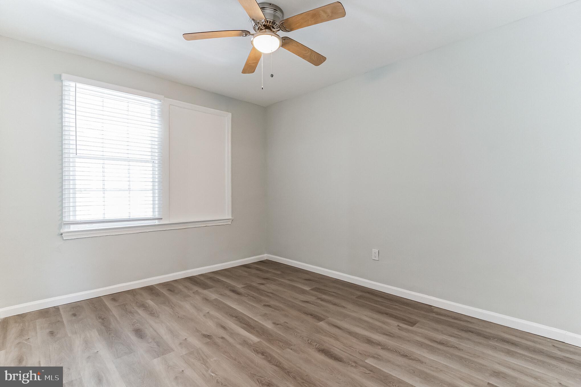 1223 Simms Place Northeast, Unit 1 Washington, DC 20002 - Photo 34 of 48 an empty room with a window and a fan