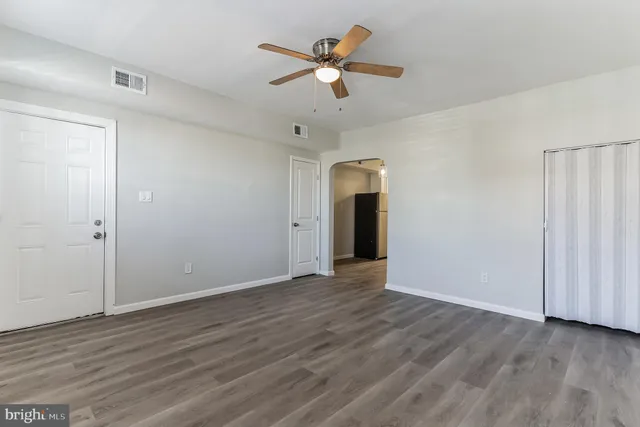 a kitchen with stainless steel appliances a stove a microwave and cabinets