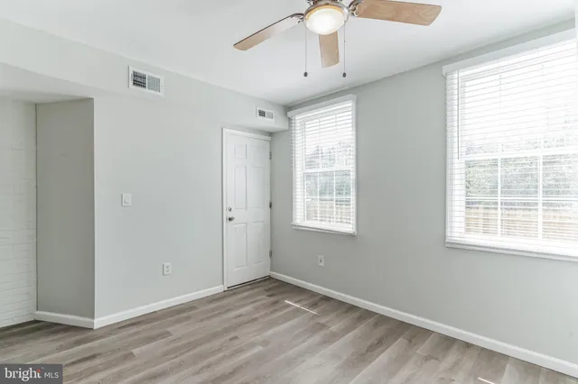 a view of a house with a yard and furniture