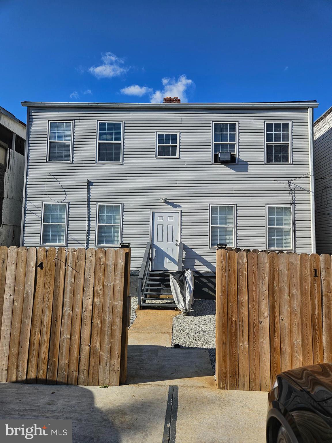1223 Simms Place Northeast, Unit 1 Washington, DC 20002 - Photo 41 of 48 a front view of a house with a yard
