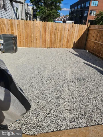 a view of a backyard with a table and chair