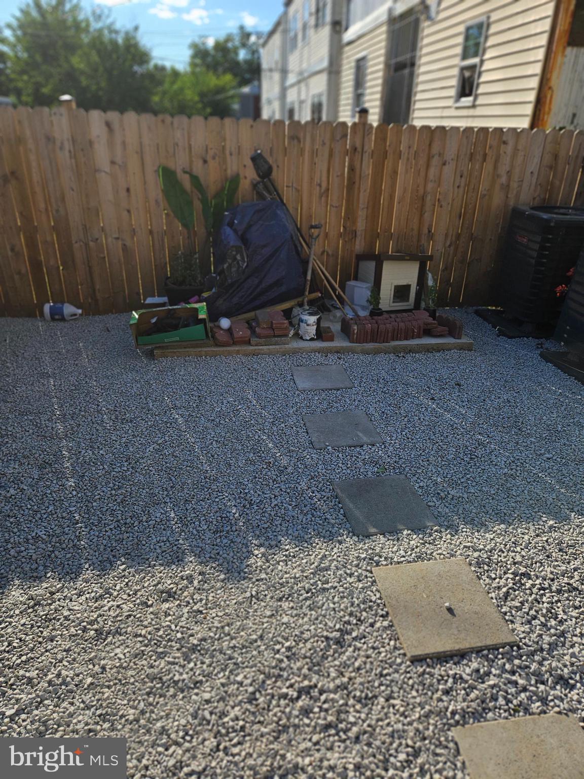 1223 Simms Place Northeast, Unit 1 Washington, DC 20002 - Photo 46 of 48 a view of a backyard with a table and chair