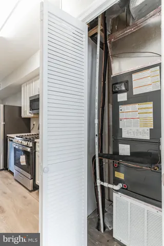 a kitchen with a refrigerator and a stove