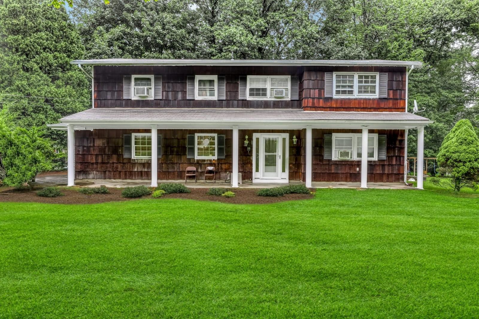 a front view of a house with garden