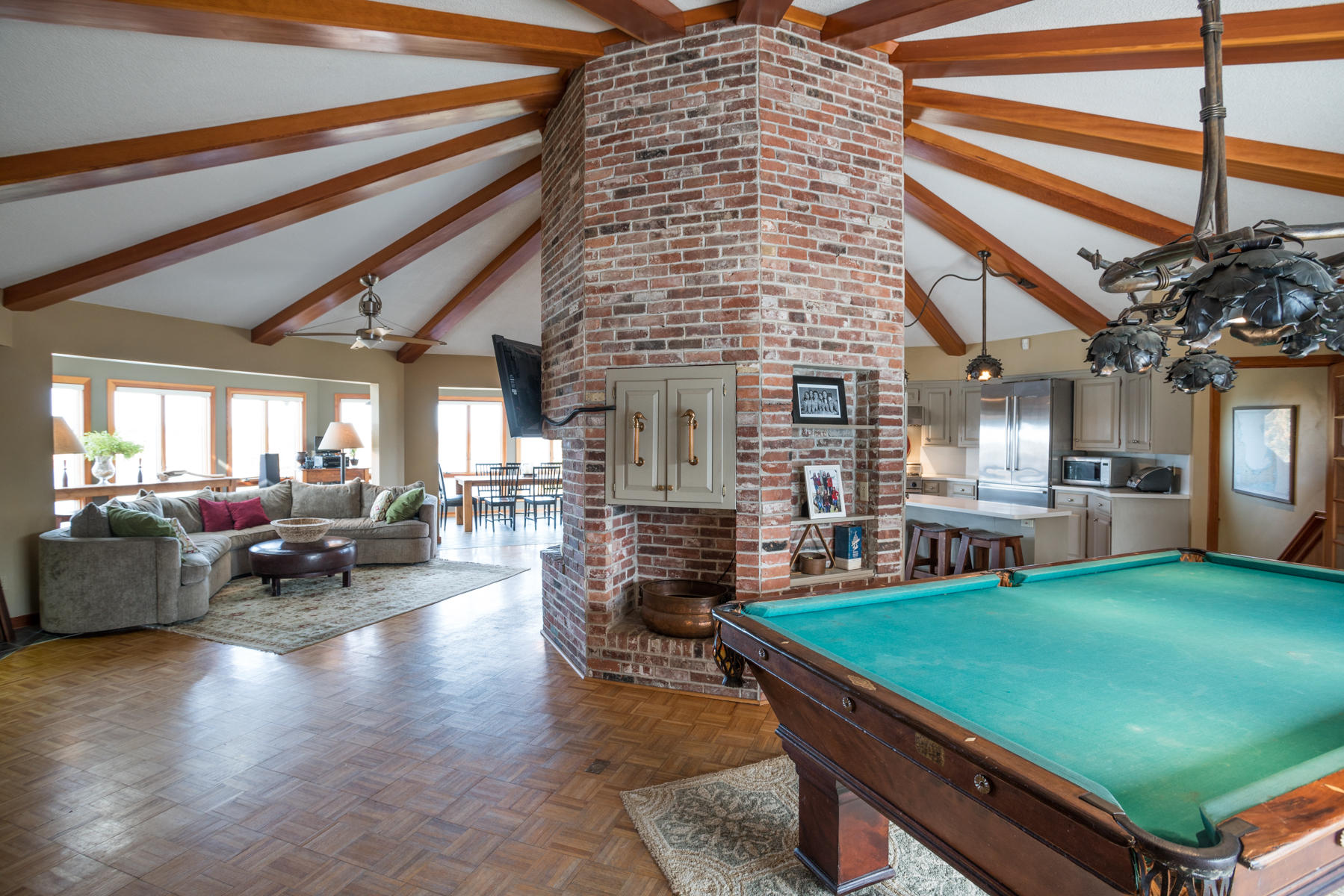 100 Freeman Lane Orleans, MA 02653 - Photo 16 of 34 a living room with fireplace furniture and a dining table