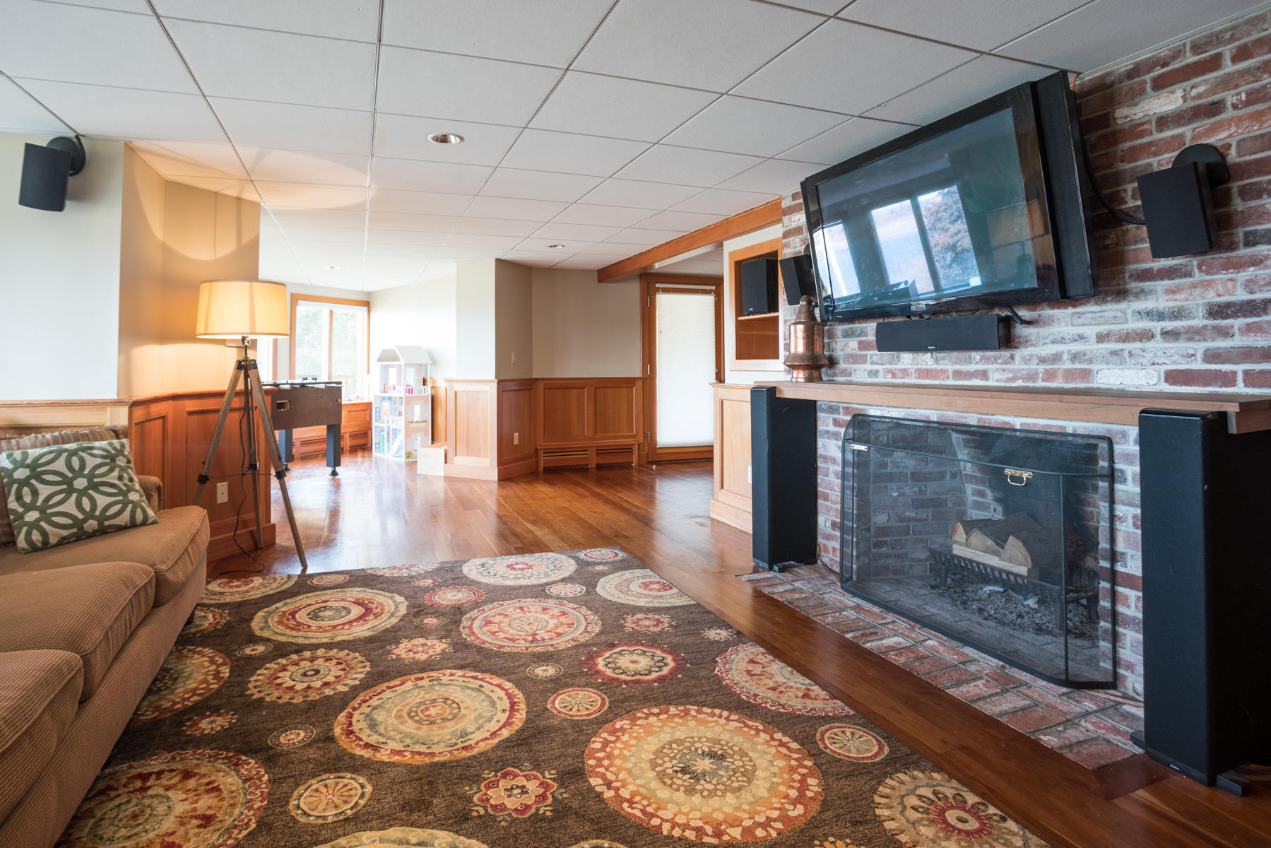 100 Freeman Lane Orleans, MA 02653 - Photo 24 of 34 a living room with furniture and a fireplace