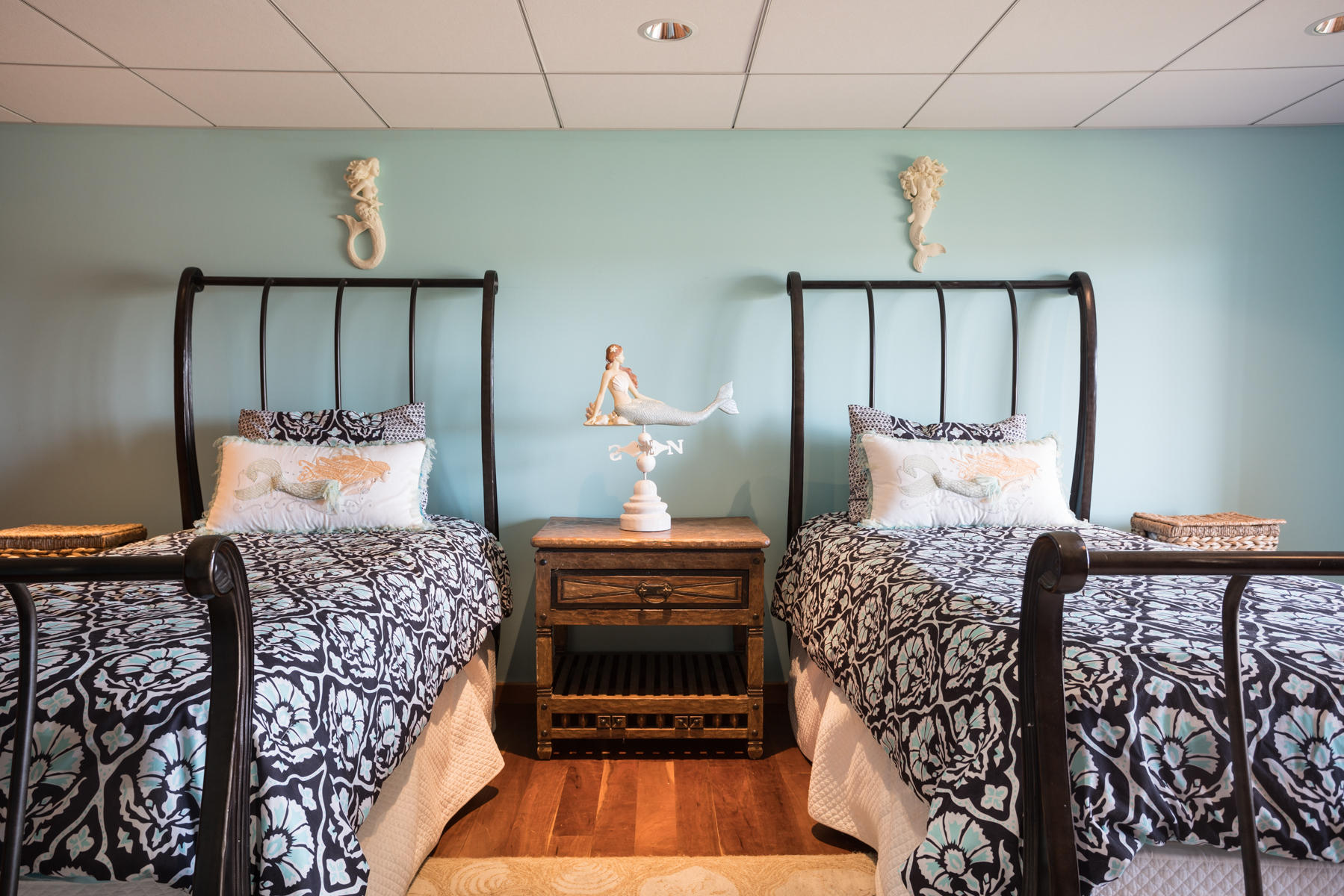 100 Freeman Lane Orleans, MA 02653 - Photo 26 of 34 a bedroom with a bed and wooden floor