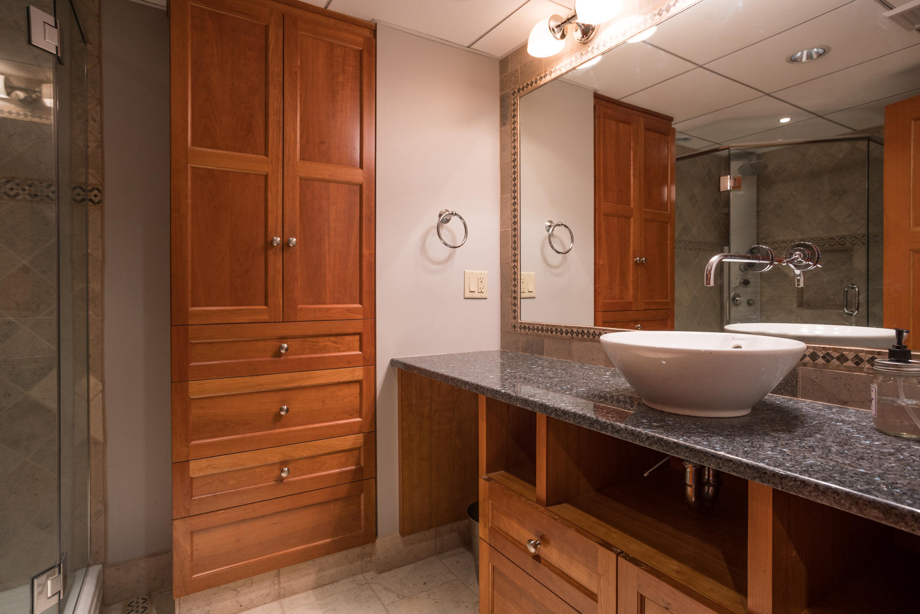 100 Freeman Lane Orleans, MA 02653 - Photo 27 of 34 a bathroom with a granite countertop sink and a mirror