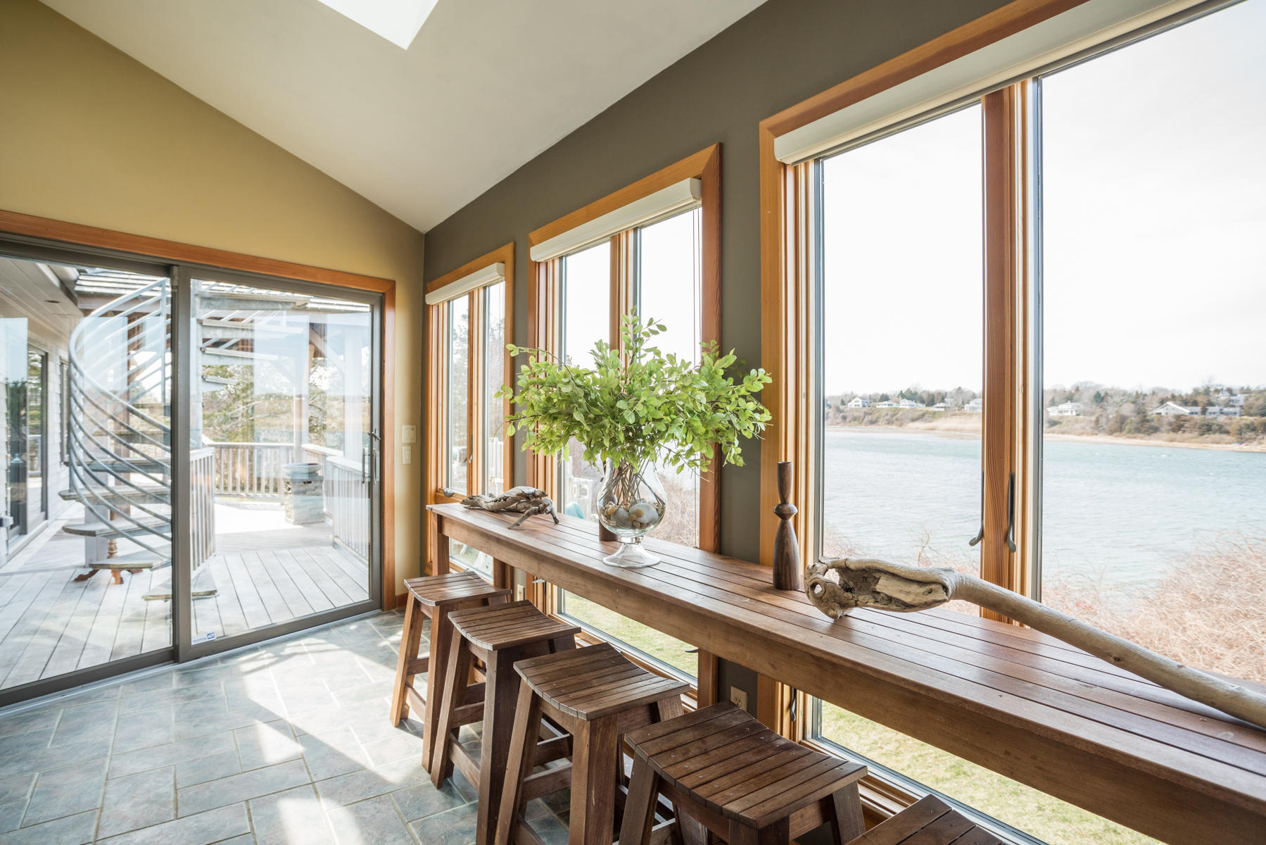 100 Freeman Lane Orleans, MA 02653 - Photo 5 of 34 a view of a living room and floor to ceiling window or wooden floor