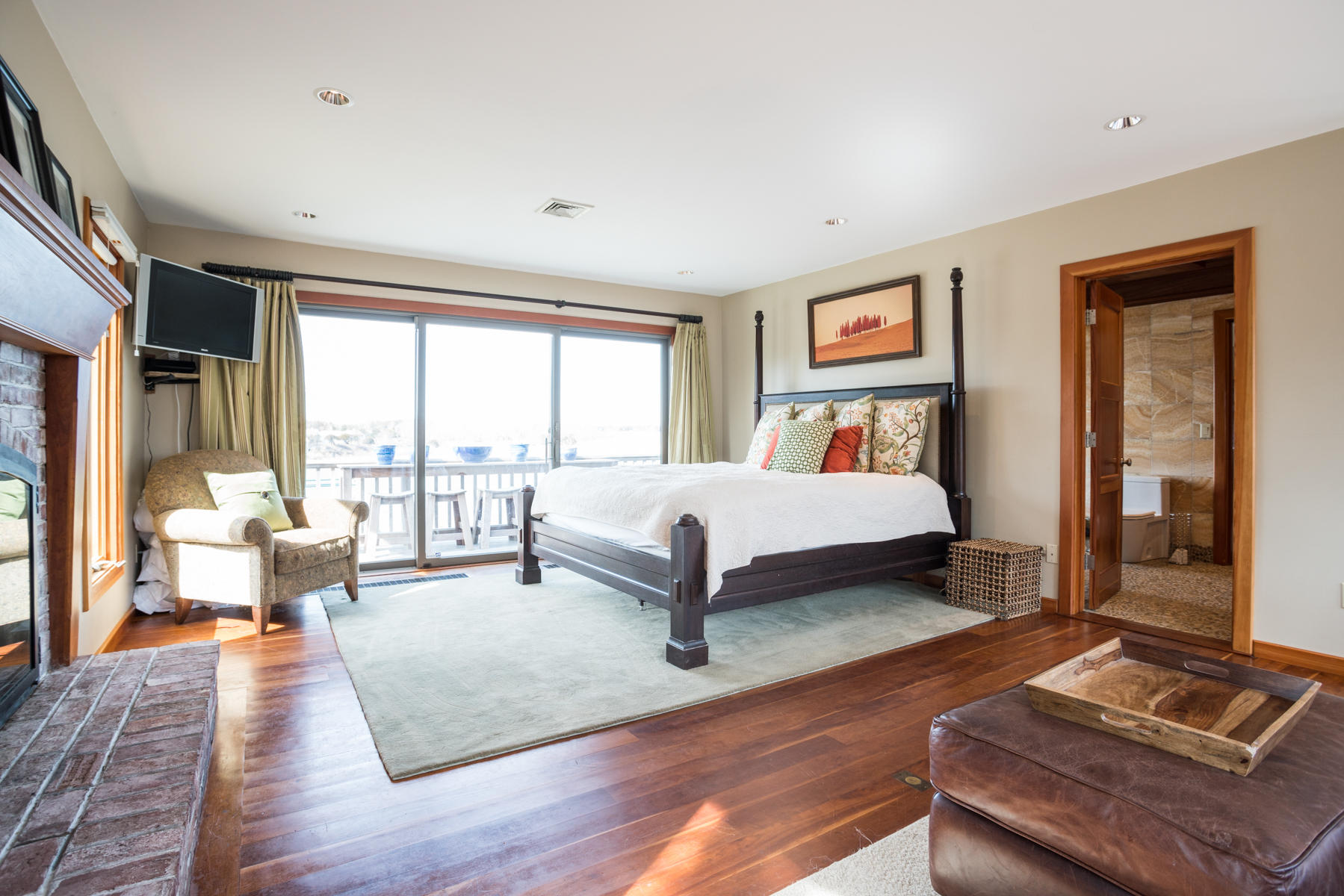 100 Freeman Lane Orleans, MA 02653 - Photo 8 of 34 a bedroom with furniture and a large window