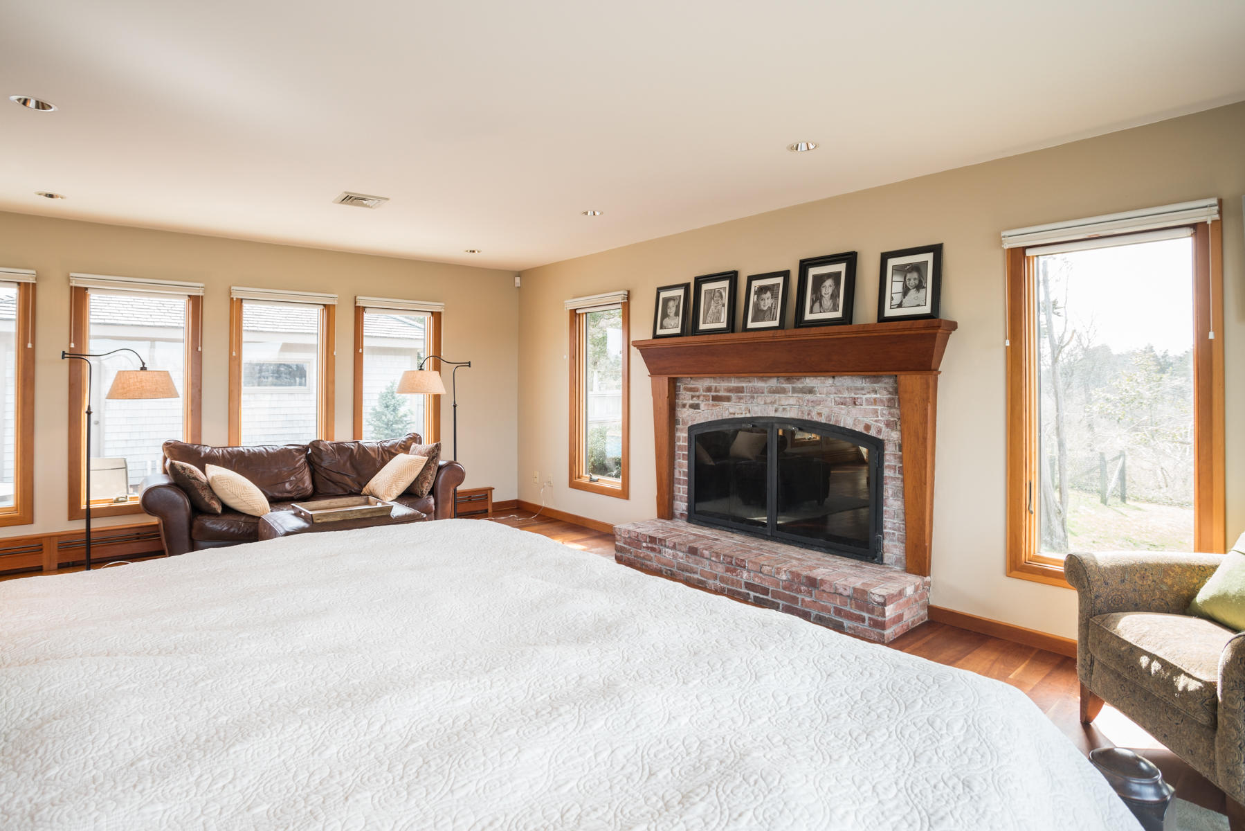 100 Freeman Lane Orleans, MA 02653 - Photo 9 of 34 a bed room with a bed and a fireplace