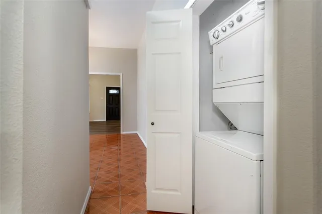 a room with a window and wooden floor